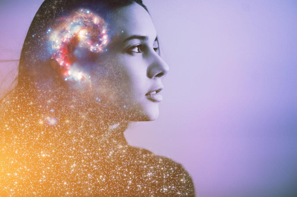 Side profile of young woman with glowing brain